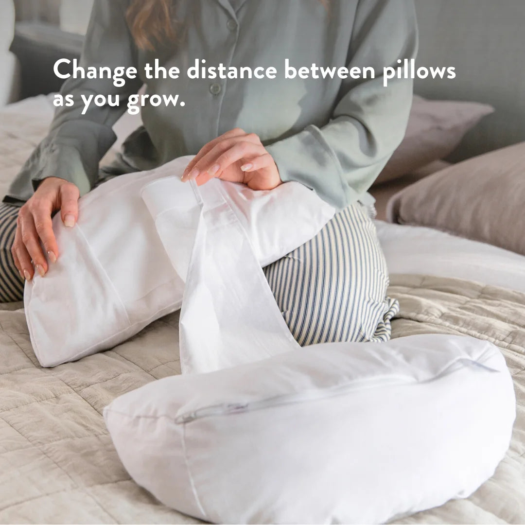 Change the distance between the pregnancy pillows as you grow.