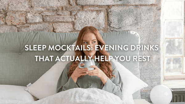person sitting up in bed drinking a sleep mocktail