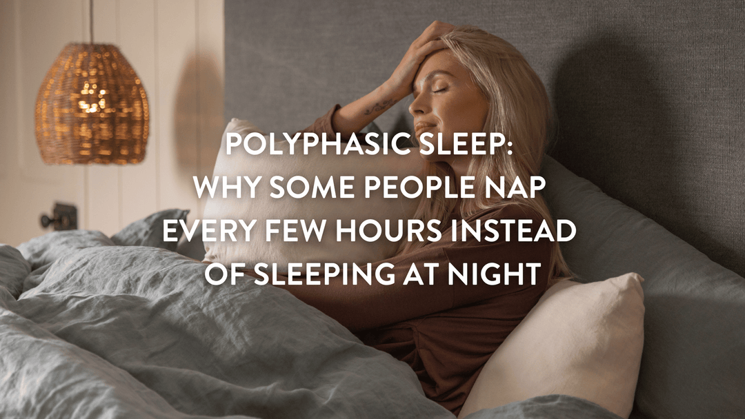 Person sitting up in a double bed with their eyes shut leaning against a Putnams pillow 