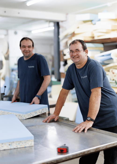 sewing machinists making pillows, bed wedges, mattresses in Devon factory. 