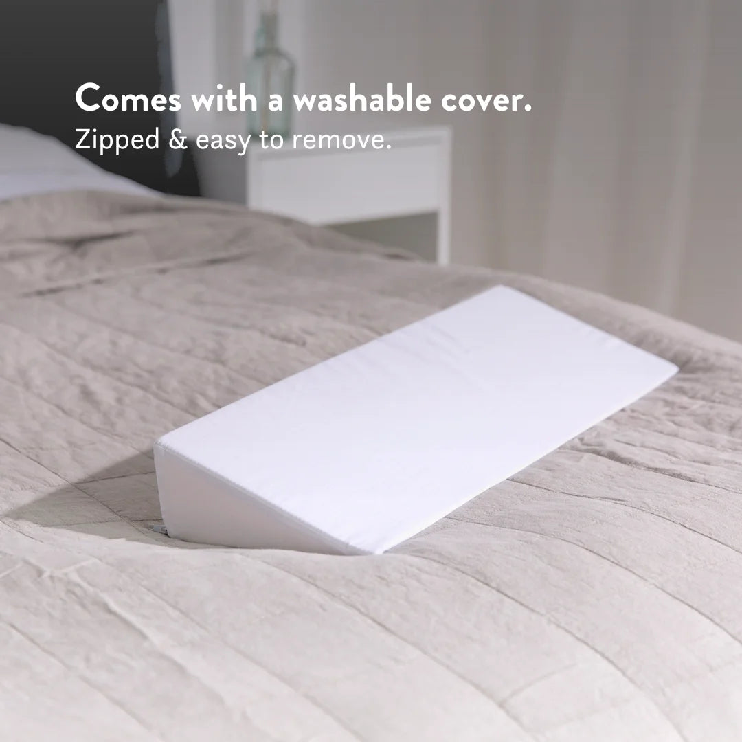 Comes with a washable cover. heel leg lift pillow to reduce pressure on heels sores bed triangle small putnams uk Cushion to lift heels off the bed to reduce pressure build up (formation of pressure sores, ulcers, & decubitus). Fitted, removable, washable cover. Handmade in the UK.